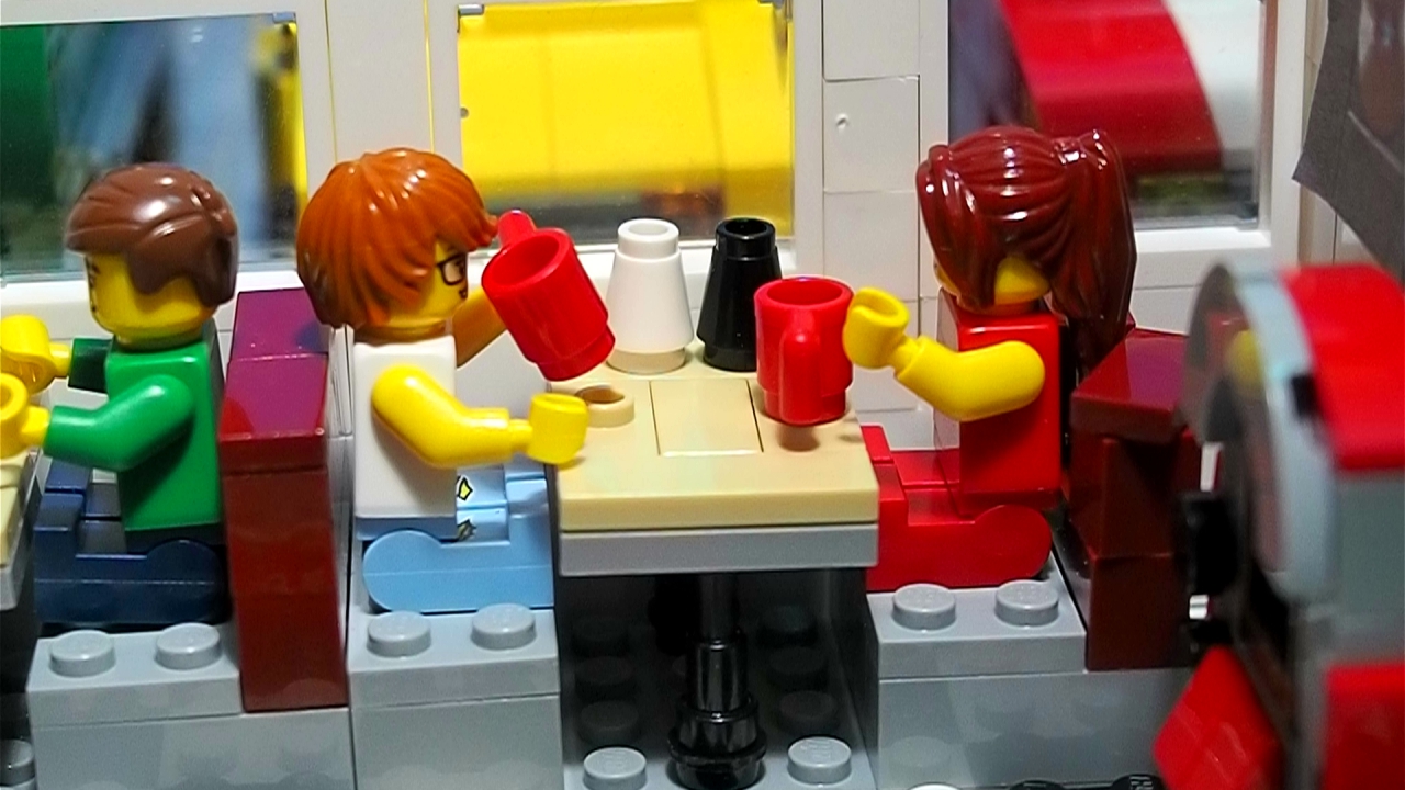 two people sitting in a booth at a diner